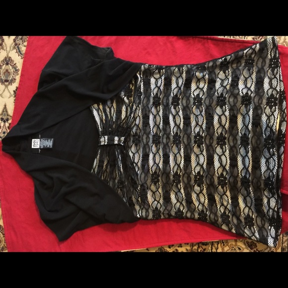 Black dress top with overlay design over white. - Picture 3 of 4